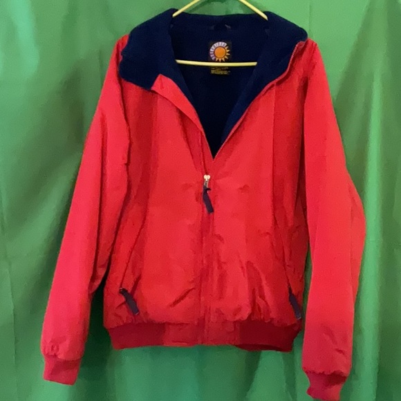 Bright red windbreaker with navy blue fleece lining and insulated sleeves. - Picture 1 of 11